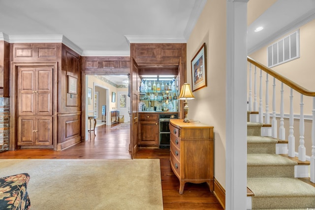 1259 Oatland Lake Rd, Pawleys Island, SC 29585 - office area featuring wood finished floors, ornamental molding, baseboards, and a bar