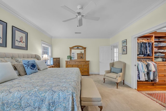 1259 Oatland Lake Rd, Pawleys Island, SC 29585 - bedroom with crown molding, light colored carpet, a spacious closet, ceiling fan, and a closet