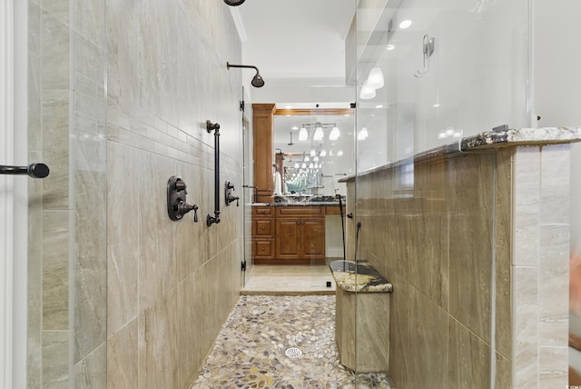 1259 Oatland Lake Rd, Pawleys Island, SC 29585 - full bath with tiled shower, vanity, tile walls, and tile patterned floors