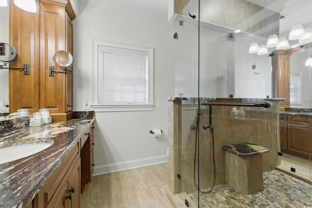 1259 Oatland Lake Rd, Pawleys Island, SC 29585 - full bathroom with vanity, a shower stall, ornamental molding, baseboards, and wood finished floors