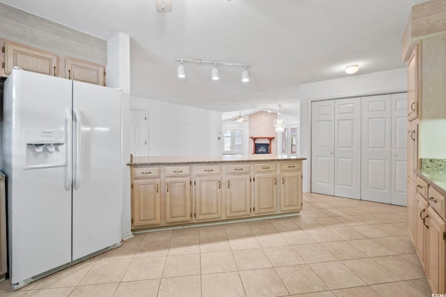 1468 Fox Hollow Way N, Myrtle Beach, SC 29582 - kitchen with white fridge with ice dispenser, light brown cabinetry, track lighting, light tile patterned floors, and light stone countertops