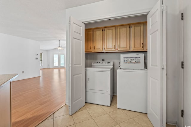1468 Fox Hollow Way N, Myrtle Beach, SC 29582 - laundry area with cabinet space, independent washer and dryer, ceiling fan, and light tile patterned floors