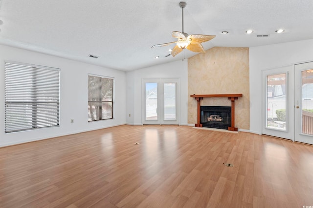 1468 Fox Hollow Way N, Myrtle Beach, SC 29582 - unfurnished living room with a ceiling fan, vaulted ceiling, light wood finished floors, a fireplace, and recessed lighting