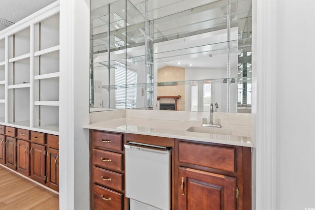 1468 Fox Hollow Way N, Myrtle Beach, SC 29582 - bar featuring a sink, light wood-style floors, healthy amount of natural light, and white dishwasher
