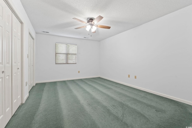 1468 Fox Hollow Way N, Myrtle Beach, SC 29582 - unfurnished bedroom with a textured ceiling, carpet flooring, and baseboards