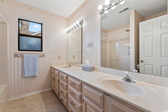 1468 Fox Hollow Way N, Myrtle Beach, SC 29582 - bathroom with a shower with door, double vanity, baseboards, tile patterned floors, and a textured ceiling