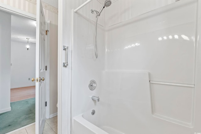 1468 Fox Hollow Way N, Myrtle Beach, SC 29582 - bathroom with washtub / shower combination, tile patterned floors, and baseboards