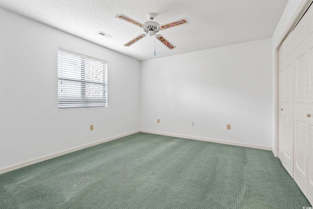 1468 Fox Hollow Way N, Myrtle Beach, SC 29582 - unfurnished bedroom featuring a textured ceiling, a closet, carpet flooring, and baseboards