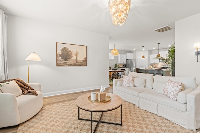 1523 Wood Stork Dr, Conway, SC 29526 - living area featuring light wood-type flooring, a chandelier, baseboards, and recessed lighting