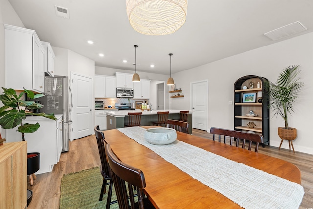 1523 Wood Stork Dr, Conway, SC 29526 - dining area with light wood finished floors and recessed lighting