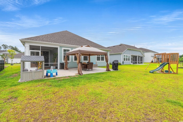 1523 Wood Stork Dr, Conway, SC 29526 - back of house with a sunroom, a patio area, a gazebo, a yard, and a playground