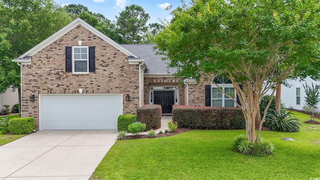 106 Cypress Creek Dr, Murrells Inlet, SC 29576 - view of front of home featuring an attached garage, a front lawn, brick siding, and driveway