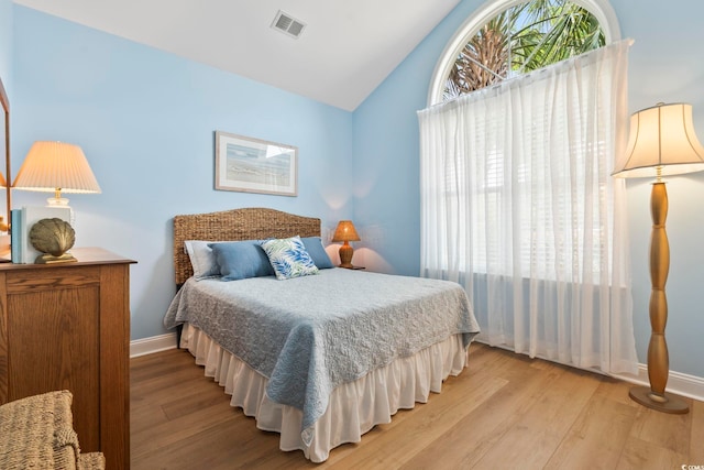106 Cypress Creek Dr, Murrells Inlet, SC 29576 - bedroom featuring vaulted ceiling, light wood-style flooring, and baseboards