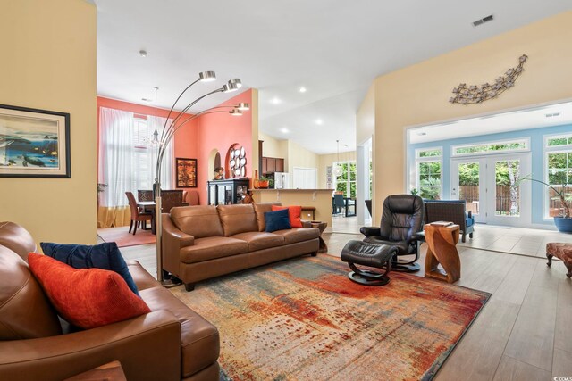 106 Cypress Creek Dr, Murrells Inlet, SC 29576 - living area featuring healthy amount of natural light, french doors, light wood-style flooring, and lofted ceiling