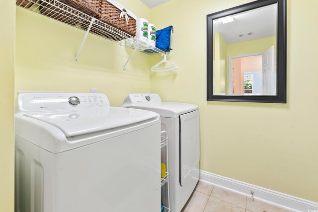 106 Cypress Creek Dr, Murrells Inlet, SC 29576 - laundry room with baseboards, washer and clothes dryer, and tile patterned flooring