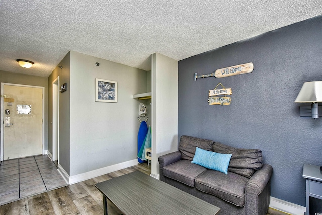 1207 S Ocean Blvd Unit 50809, Myrtle Beach, SC 29577 - living area with wood finished floors, a textured ceiling, and baseboards