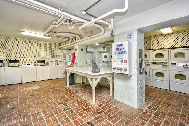 1207 S Ocean Blvd Unit 50809, Myrtle Beach, SC 29577 - shared laundry with estacked washer and dryer, separate washer and dryer, and brick flooring