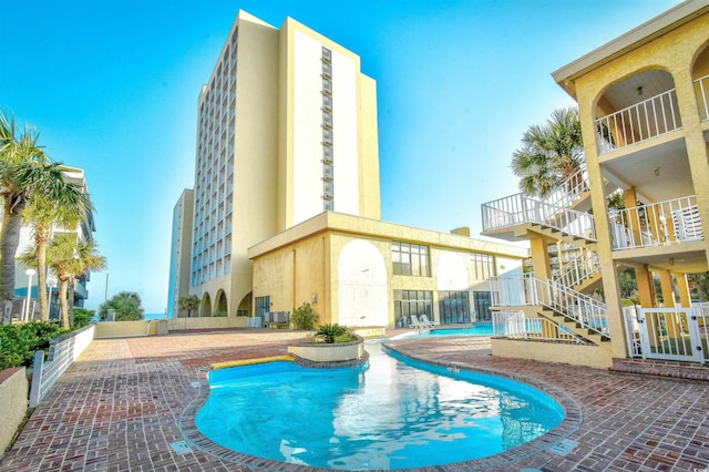 1207 S Ocean Blvd Unit 50809, Myrtle Beach, SC 29577 - community pool with stairway and a patio