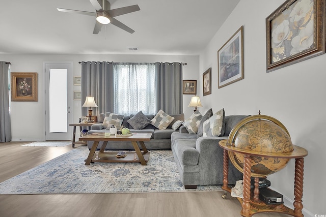 79 S Reindeer Rd, Surfside Beach, SC 29575 - living room with wood finished floors, a ceiling fan, and baseboards