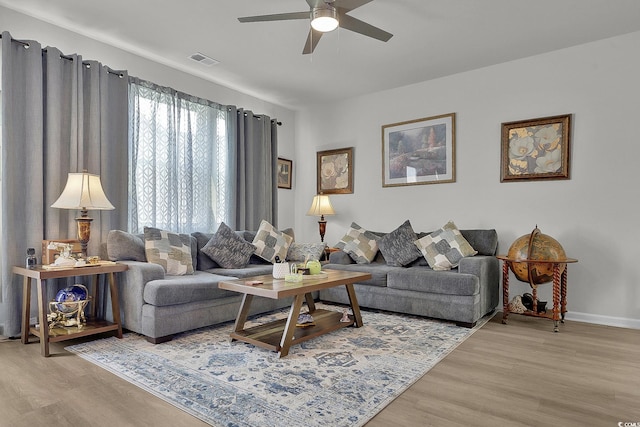 79 S Reindeer Rd, Surfside Beach, SC 29575 - living room featuring ceiling fan, wood finished floors, and baseboards
