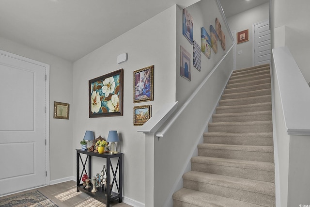 79 S Reindeer Rd, Surfside Beach, SC 29575 - foyer featuring stairway, baseboards, and wood finished floors
