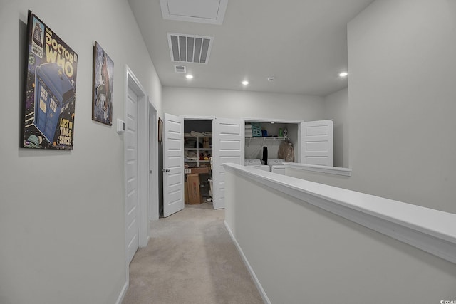 79 S Reindeer Rd, Surfside Beach, SC 29575 - hall with recessed lighting, baseboards, washing machine and dryer, and light carpet