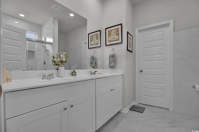 79 S Reindeer Rd, Surfside Beach, SC 29575 - full bath with double vanity, marble look tiles, recessed lighting, and a shower