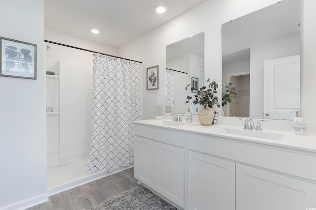 169 Dagger Ct, Myrtle Beach, SC 29588 - full bath with double vanity, a shower with shower curtain, and wood finished floors