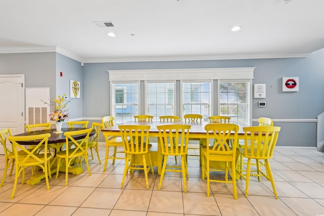 931 S Ocean Blvd, North Myrtle Beach, SC 29582 - dining area featuring ornamental molding, healthy amount of natural light, light tile patterned floors, and recessed lighting