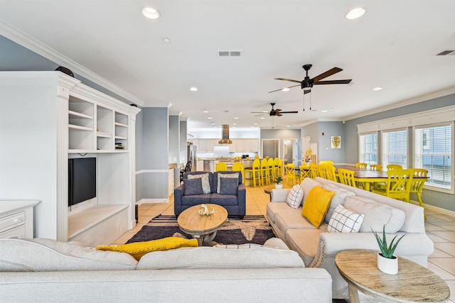 931 S Ocean Blvd, North Myrtle Beach, SC 29582 - living area with recessed lighting, ceiling fan, light tile patterned floors, and crown molding
