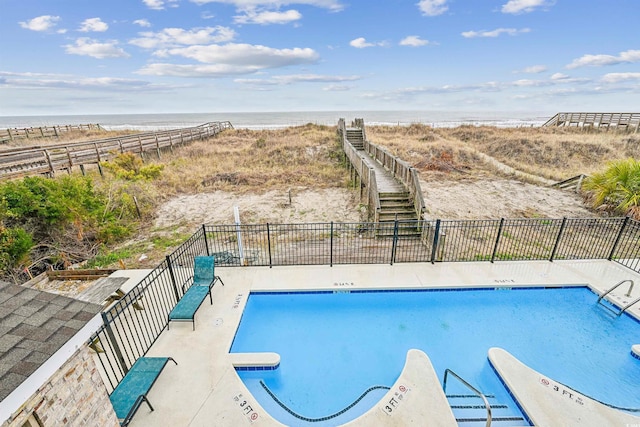 931 S Ocean Blvd, North Myrtle Beach, SC 29582 - community pool with view of water and beach and a patio