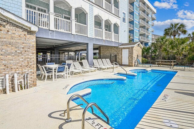 931 S Ocean Blvd, North Myrtle Beach, SC 29582 - community pool featuring a patio