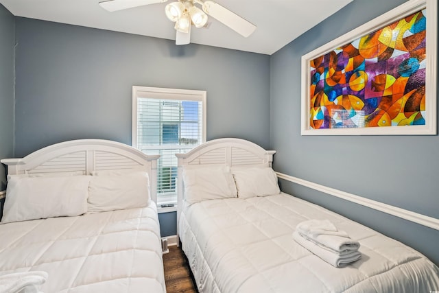 931 S Ocean Blvd, North Myrtle Beach, SC 29582 - bedroom with wood finished floors and a ceiling fan