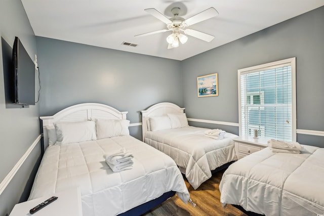 931 S Ocean Blvd, North Myrtle Beach, SC 29582 - bedroom with wood finished floors and ceiling fan