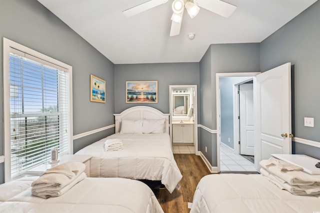 931 S Ocean Blvd, North Myrtle Beach, SC 29582 - bedroom featuring multiple windows, wood finished floors, ceiling fan, and connected bathroom