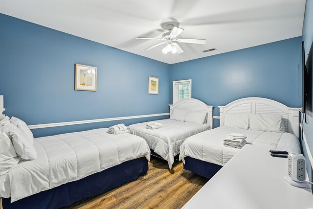 931 S Ocean Blvd, North Myrtle Beach, SC 29582 - bedroom featuring wood finished floors and a ceiling fan