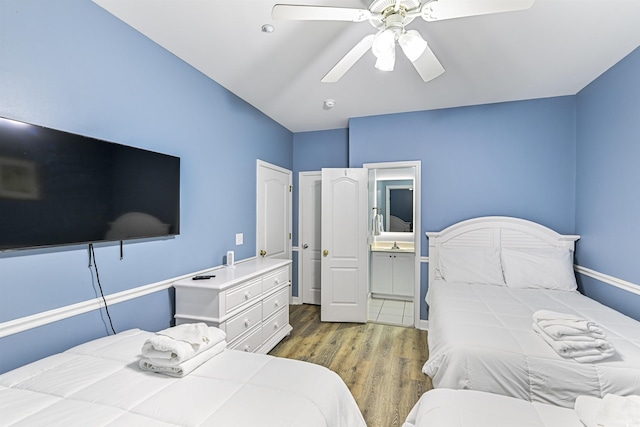 931 S Ocean Blvd, North Myrtle Beach, SC 29582 - bedroom with wood finished floors, connected bathroom, and a ceiling fan