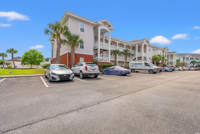 4142 Hibiscus Dr Unit 20-202, Little River, SC 29566 - view of property with uncovered parking and a residential view