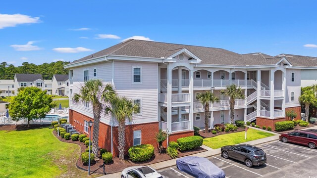 4142 Hibiscus Dr Unit 20-202, Little River, SC 29566 - view of building exterior with uncovered parking
