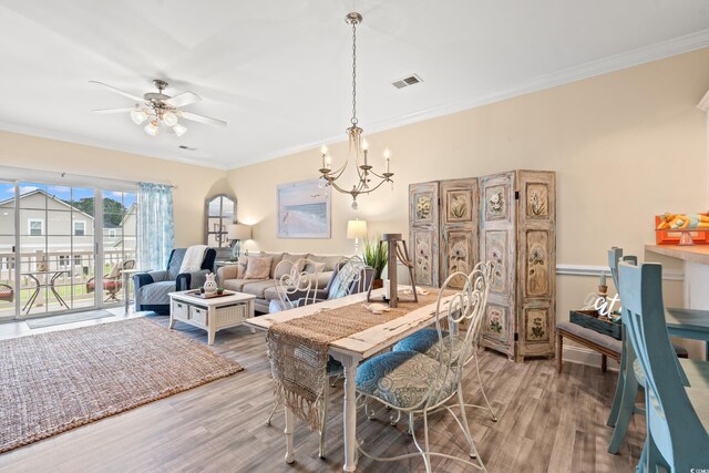 4142 Hibiscus Dr Unit 20-202, Little River, SC 29566 - dining space with crown molding, light wood-type flooring, a chandelier, and ceiling fan