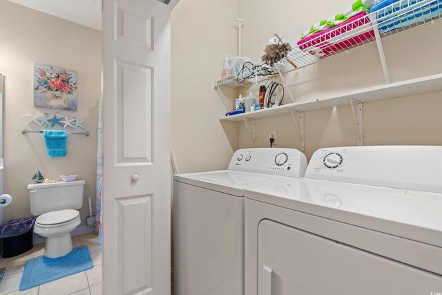 4142 Hibiscus Dr Unit 20-202, Little River, SC 29566 - washroom with independent washer and dryer and light tile patterned flooring