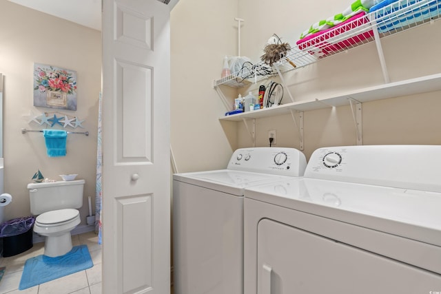 4142 Hibiscus Dr Unit 20-202, Little River, SC 29566 - washroom featuring separate washer and dryer and light tile patterned flooring