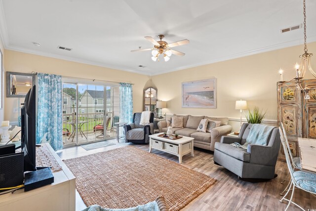 4142 Hibiscus Dr Unit 20-202, Little River, SC 29566 - living area with a ceiling fan, wood finished floors, and crown molding