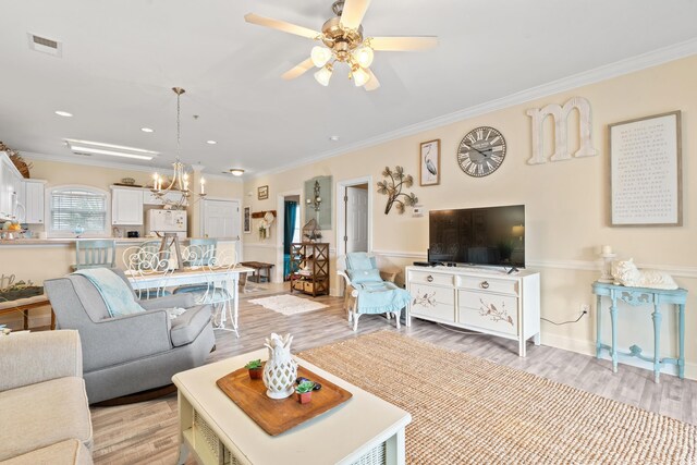 4142 Hibiscus Dr Unit 20-202, Little River, SC 29566 - living room with a chandelier, ornamental molding, light wood-style floors, a ceiling fan, and recessed lighting