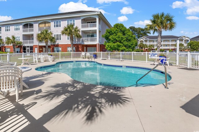 4142 Hibiscus Dr Unit 20-202, Little River, SC 29566 - community pool featuring a patio area