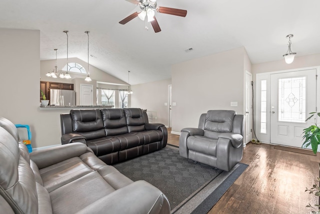 282 Foxpath Loop, Myrtle Beach, SC 29588 - living room featuring wood finished floors, a ceiling fan, lofted ceiling, baseboards, and a chandelier
