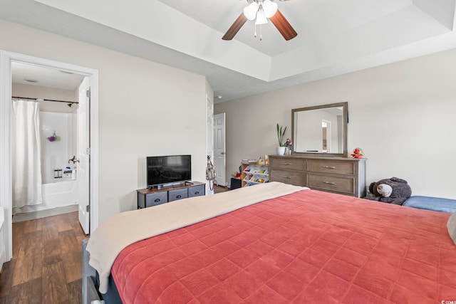 282 Foxpath Loop, Myrtle Beach, SC 29588 - bedroom featuring dark wood finished floors, ensuite bath, ceiling fan, and a raised ceiling