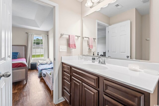 282 Foxpath Loop, Myrtle Beach, SC 29588 - bathroom with wood finished floors, connected bathroom, and vanity