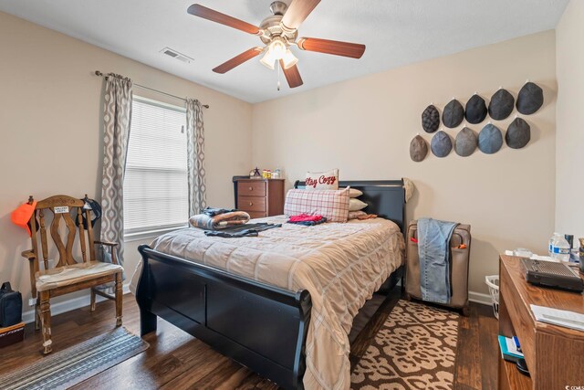 282 Foxpath Loop, Myrtle Beach, SC 29588 - bedroom featuring dark wood-style flooring, a ceiling fan, and baseboards