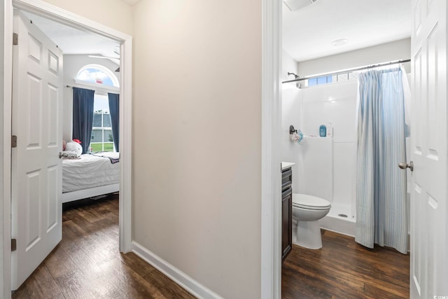 282 Foxpath Loop, Myrtle Beach, SC 29588 - ensuite bathroom featuring wood finished floors, a stall shower, healthy amount of natural light, and toilet